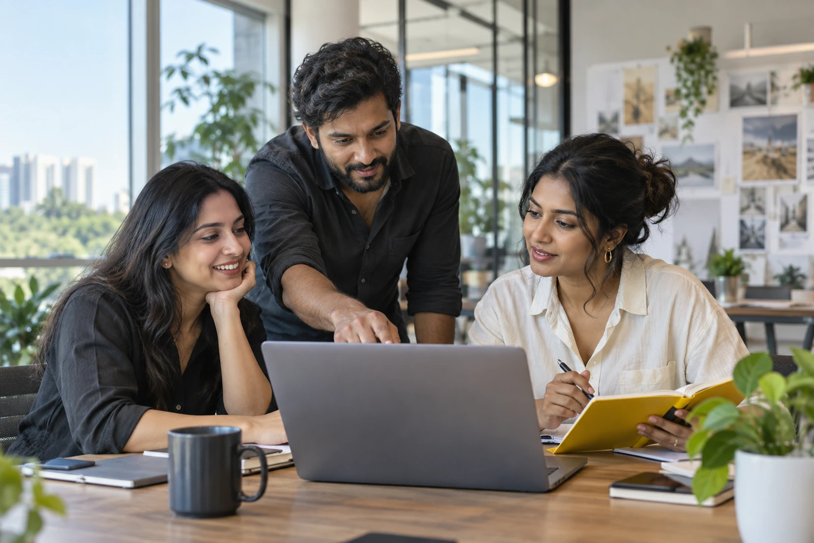 Indian technology professionals discussing a project together.